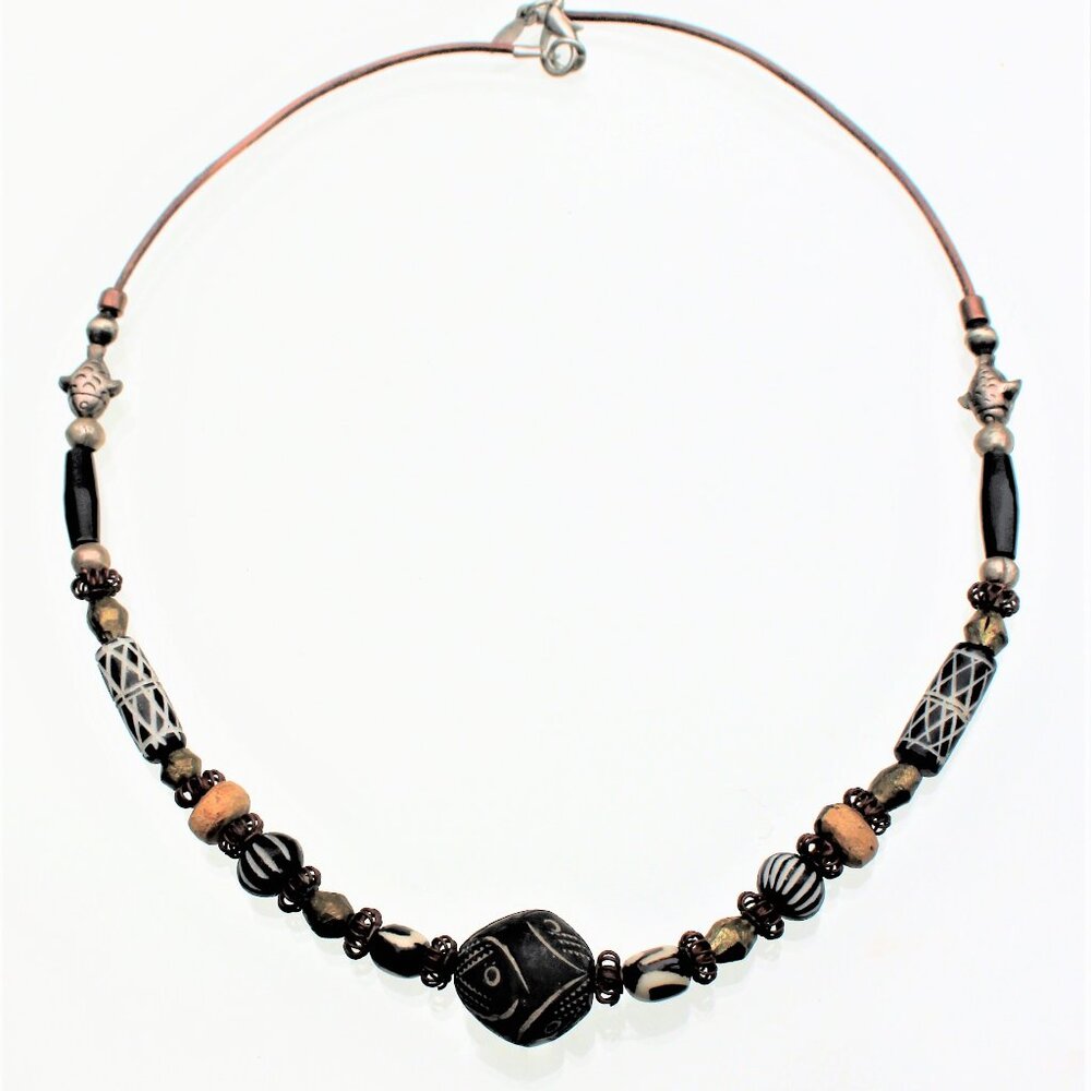 The Kenyan Bisque Clay 40 mm Round Bead has an Abstract Design Scratched into it